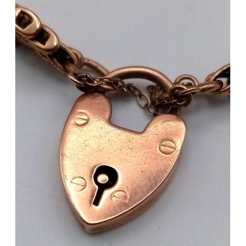 115 - AN ANTIQUE ROSE GOLD GATE BRACELET IN 9K GOLD WITH HEART PADLOCK .   17.6gms