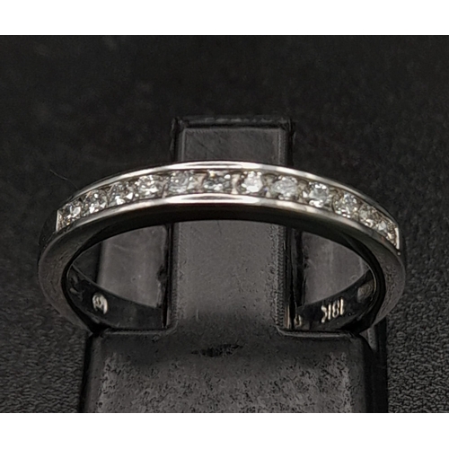 208 - 18K WHITE GOLD DIAMOND SET BAND RING.  0.15CT DIAMOND. TOTAL WEIGHT 2.1G.  SIZE H