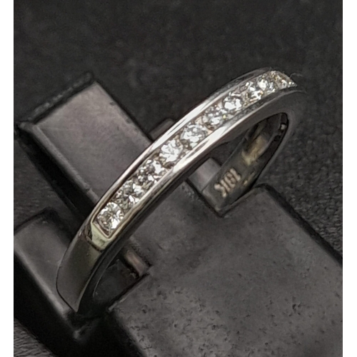 208 - 18K WHITE GOLD DIAMOND SET BAND RING.  0.15CT DIAMOND. TOTAL WEIGHT 2.1G.  SIZE H