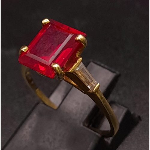 250 - 9K YELLOW GOLD RED AND WHITE STONE RING. TOTAL WEIGHT 2.8G.  SIZE N