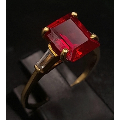 250 - 9K YELLOW GOLD RED AND WHITE STONE RING. TOTAL WEIGHT 2.8G.  SIZE N