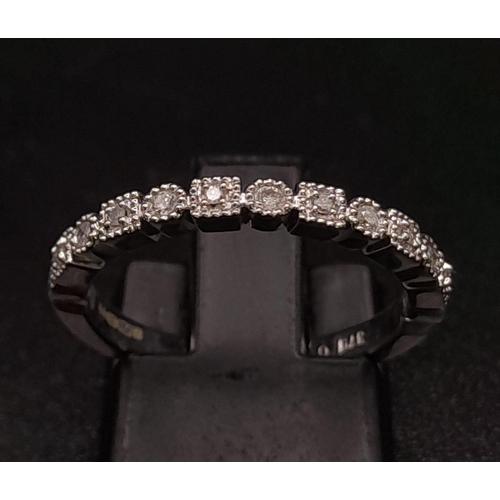 264 - 9K WHITE GOLD DIAMOND BAND RING. TOTAL WEIGHT 2.44G. SIZE L