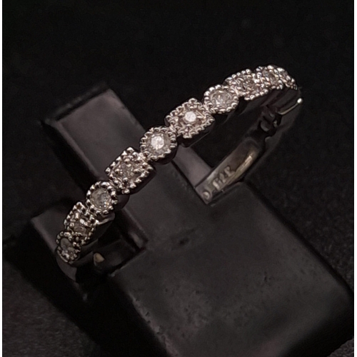 264 - 9K WHITE GOLD DIAMOND BAND RING. TOTAL WEIGHT 2.44G. SIZE L