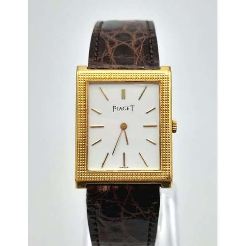 267 - A Classic Piaget Mechanical Tank Watch. Brown leather strap. Gold plated case - 23mm width. White di... 