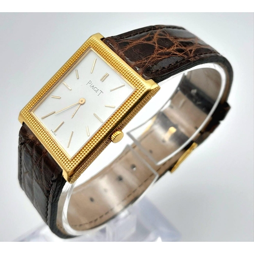 A Classic Piaget Mechanical Tank Watch. Brown leather strap. Gold