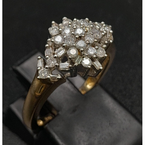 313 - 9K YELLOW GOLD DIAMOND CLUSTER RING.  0.50CT DIAMOND. TOTAL WEIGHT 2.8G.  SIZE L