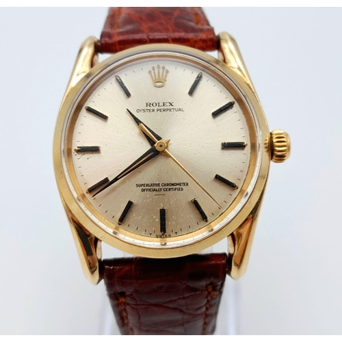 477 - A Vintage Rolex 14K Gold Oyster Perpetual Gents Watch. Brown leather strap. 14k gold case - 34mm. Si... 