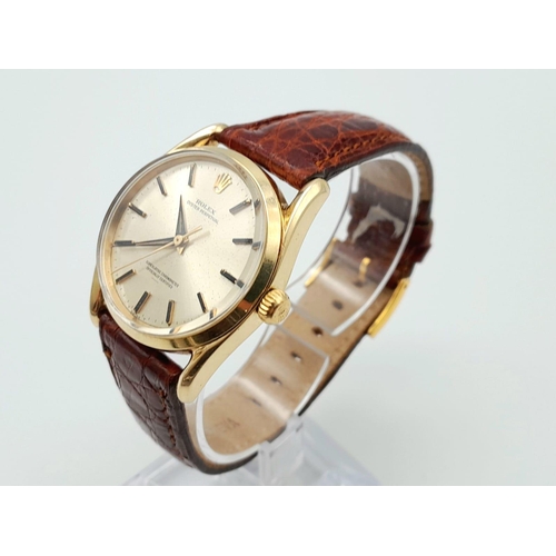 477 - A Vintage Rolex 14K Gold Oyster Perpetual Gents Watch. Brown leather strap. 14k gold case - 34mm. Si... 