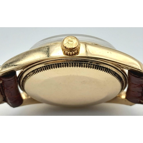 477 - A Vintage Rolex 14K Gold Oyster Perpetual Gents Watch. Brown leather strap. 14k gold case - 34mm. Si... 