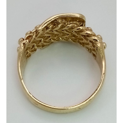 74 - A 9K YELLOW GOLD BUCKLE KEEPER RING 7.6G SIZE U