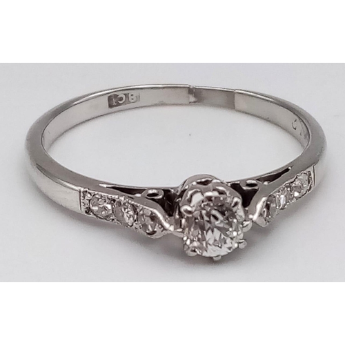 151 - 18K WHITE GOLD DIAMOND SOLITAIRE WITH DIAMOND SHOULDERS.  0.20CT MAIN STONE.  TOTAL 0.32CT. TOTAL WE... 