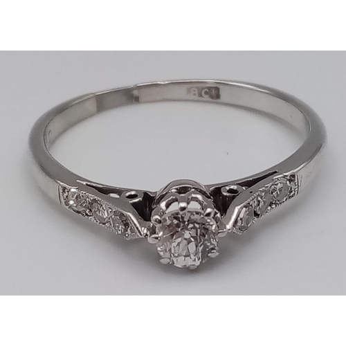 151 - 18K WHITE GOLD DIAMOND SOLITAIRE WITH DIAMOND SHOULDERS.  0.20CT MAIN STONE.  TOTAL 0.32CT. TOTAL WE... 