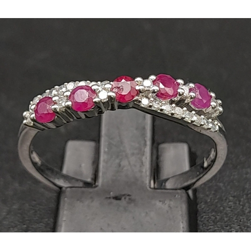 396 - 9K WHITE GOLD DIAMOND & RUBY TWIST CROSSOVER RING 2.3G SIZE R