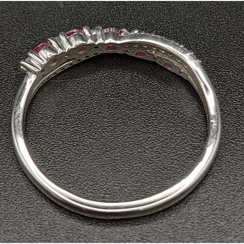 396 - 9K WHITE GOLD DIAMOND & RUBY TWIST CROSSOVER RING 2.3G SIZE R