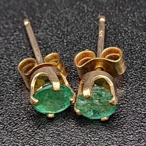 416 - A Pair of 9K Yellow Gold Emerald Stud Earrings. 0.5g total weight.