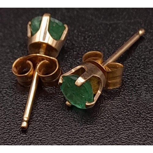 416 - A Pair of 9K Yellow Gold Emerald Stud Earrings. 0.5g total weight.