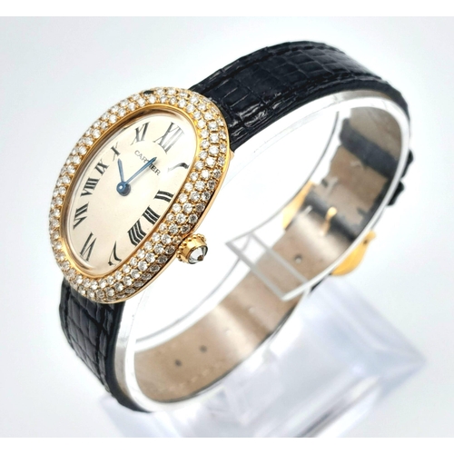 484 - An 18K Gold and Diamond Ladies Cartier Watch. Black leather strap. Gold case - 23mm width with a dia... 