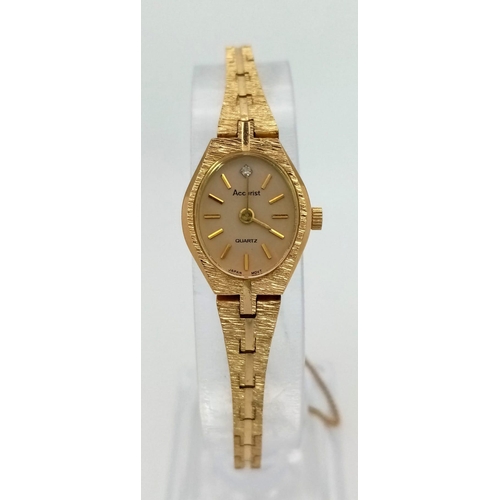 1623 - A Vintage Gold Plated Accurist Ladies Watch. Gold plated strap and case - 16mm. White stone at 12. Q... 