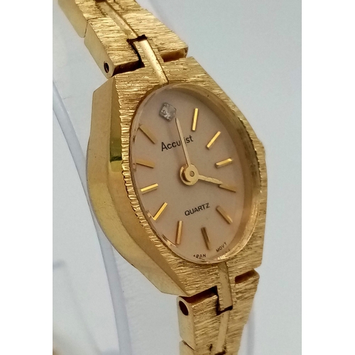 1623 - A Vintage Gold Plated Accurist Ladies Watch. Gold plated strap and case - 16mm. White stone at 12. Q... 