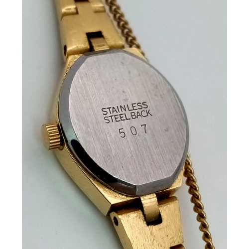 1623 - A Vintage Gold Plated Accurist Ladies Watch. Gold plated strap and case - 16mm. White stone at 12. Q... 