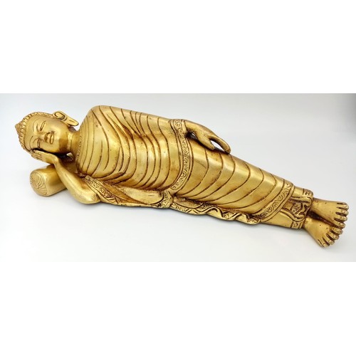 1632 - A Large Brass Reclining Buddha Figure with Head-Rest Pillow. 37cm length. 2.4k weight.