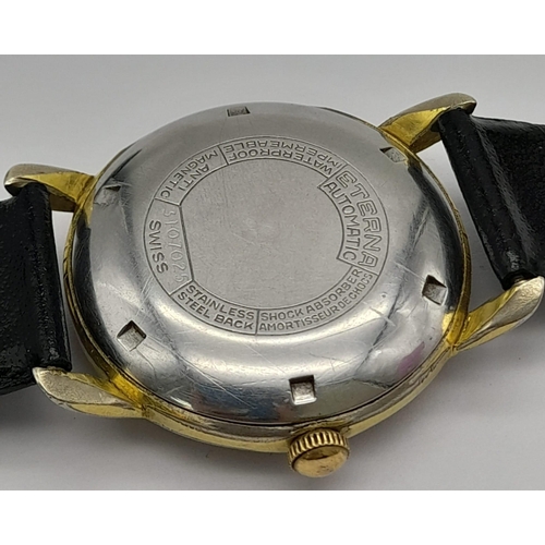 156 - A Vintage Eterna-Matic Gents Watch. Black leather strap. Two-tone case - 34mm. Black dial with secon... 