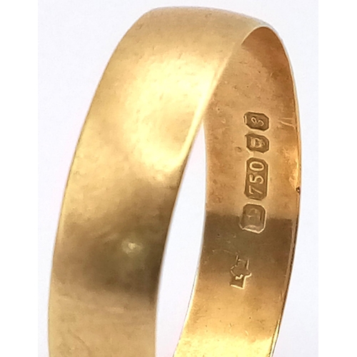 207 - A 18K GOLD BAND RING .   2.25gms    size T