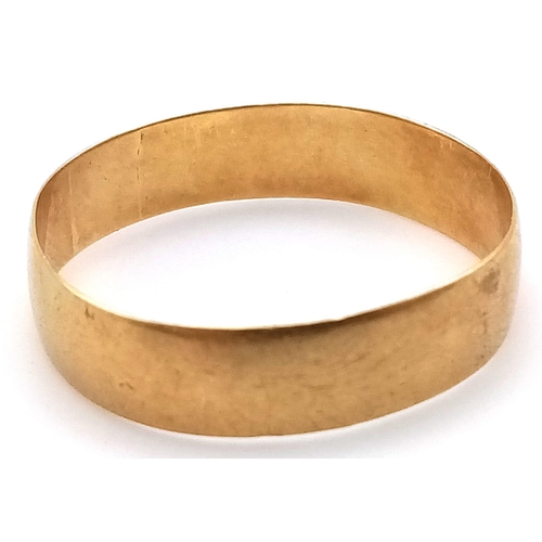 207 - A 18K GOLD BAND RING .   2.25gms    size T