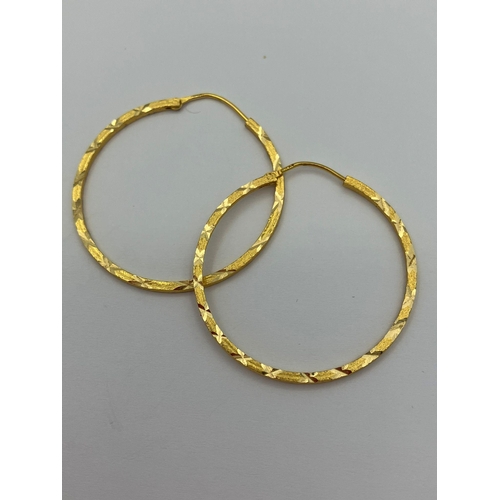 263 - Pair of 10 carat YELLOW GOLD HOOP EARRINGS, Having attractive chased diamond cut pattern. 3.2 cm dia... 