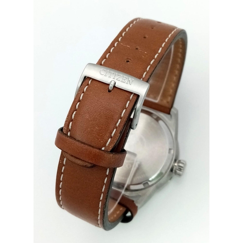 379 - A Citizen Eco Drive Gents Watch. Brown leather citizen strap. Stainless steel case - 45mm. Black dia... 