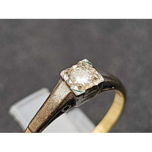 1649 - An 18K yellow gold solitaire diamond ring. Size N1/2, weight 2.5g.