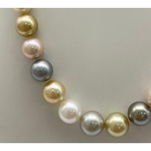 235 - A Tahitian South Sea Multicolour Pearl Necklace with a 14K Yellow Gold and Diamond Ball Clasp. Pearl... 