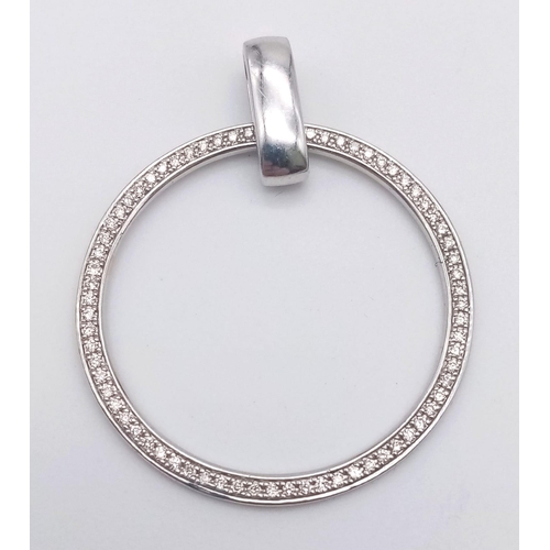 246 - AN 18K WHITE GOLD DIAMOND ENCRUSTED PENDANT ,  1.7gms    2,5cms diameter.