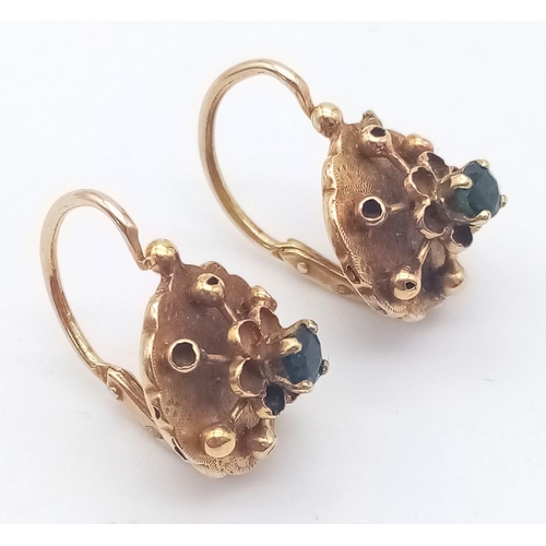 400 - A PAIR OF 18K ROSE GOLD EARRINGS WITH SAPPHIRE CENTRE STONES .2.2gms