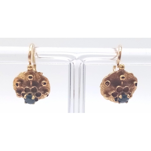 400 - A PAIR OF 18K ROSE GOLD EARRINGS WITH SAPPHIRE CENTRE STONES .2.2gms