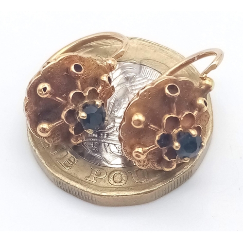 400 - A PAIR OF 18K ROSE GOLD EARRINGS WITH SAPPHIRE CENTRE STONES .2.2gms