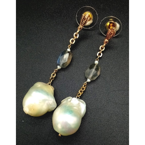 303 - A PAIR OF NATURAL PEARL DROP EARRINGS SET IN ROSE GOLD AND CRYSTAL WITH A 4cms DROP.    11,1gms