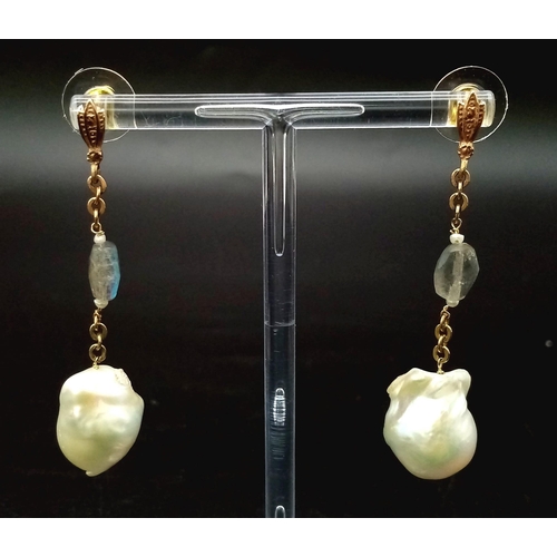 303 - A PAIR OF NATURAL PEARL DROP EARRINGS SET IN ROSE GOLD AND CRYSTAL WITH A 4cms DROP.    11,1gms