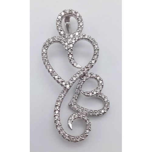 253 - A DESIGNER HEAVY WHITE GOLD DIAMOND PENDANT .  5.9gms   3.8cms drop