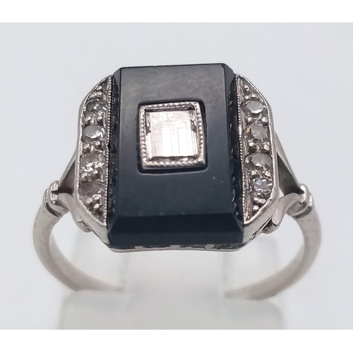 162 - A STUNNING 18K WHITE GOLD , BLACK ONYX AND DIAMOND RING . 3.7gms   size J