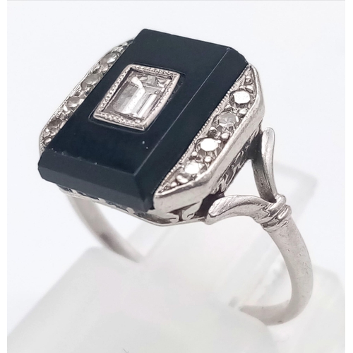 162 - A STUNNING 18K WHITE GOLD , BLACK ONYX AND DIAMOND RING . 3.7gms   size J