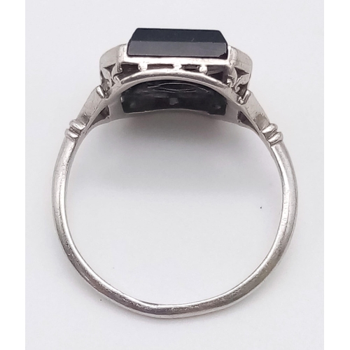 162 - A STUNNING 18K WHITE GOLD , BLACK ONYX AND DIAMOND RING . 3.7gms   size J