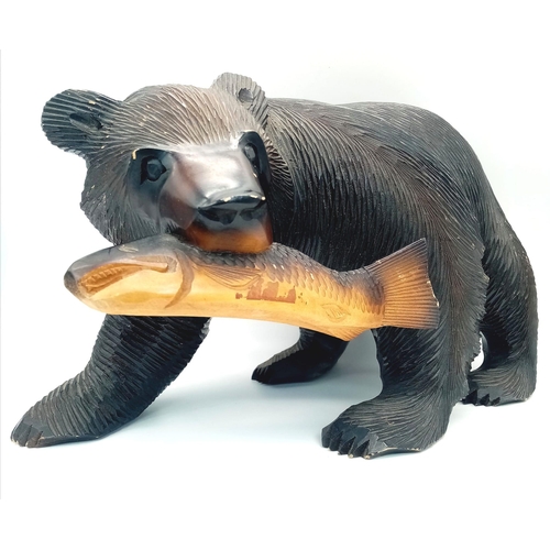 1630 - A Wooden Grizzly Bear and Unlucky Salmon Sculpture. 40cm x 25cm.