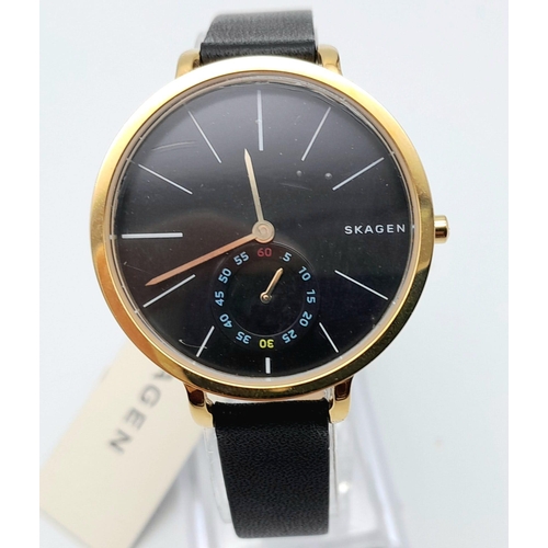 1638 - A Skagen of Denmark Quartz Ladies Watch. Blue leather strap. Gilded steel case - 34mm. Black dial wi... 