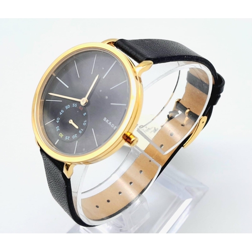 1638 - A Skagen of Denmark Quartz Ladies Watch. Blue leather strap. Gilded steel case - 34mm. Black dial wi... 