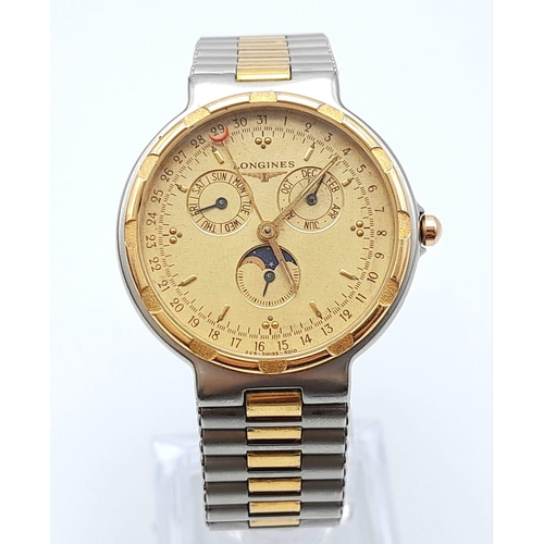 234 - A Longine Conquest Moon Phase Watch. Two-tone stainless steel strap and case - 33mm. Gold tone dial ... 