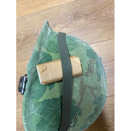 442 - A Vietnam War Era USA M1 Helmet with Foliage Band, Matches and Big Roll. Dated 1968/9. Ref: ML 144