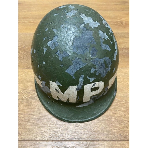 456 - A WW2 USA M1 MP Helmet. The paint is flaky from age, but the majority remains. Ref: ML145