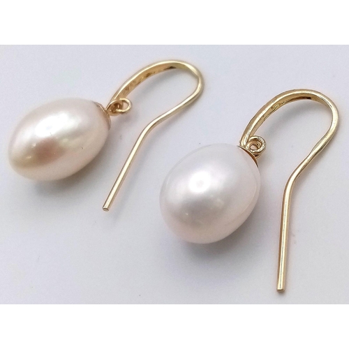 474 - A Pair of 9K Yellow Gold Pearl Earrings. 4.03g total weight.