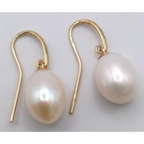 474 - A Pair of 9K Yellow Gold Pearl Earrings. 4.03g total weight.